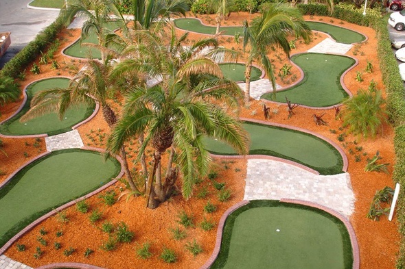 Edmonton Aerial view of a mini golf course with synthetic grass and palm trees.